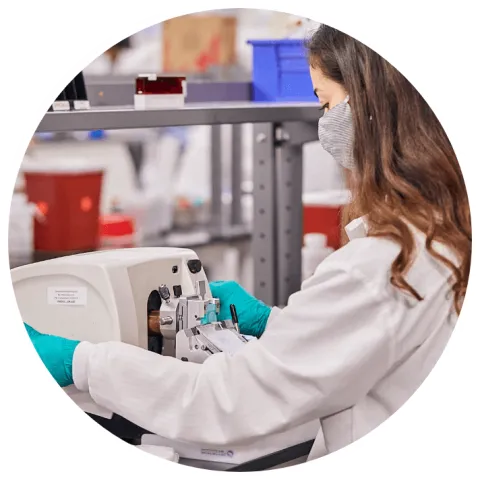 Scientist slicing specimens for laboratory work